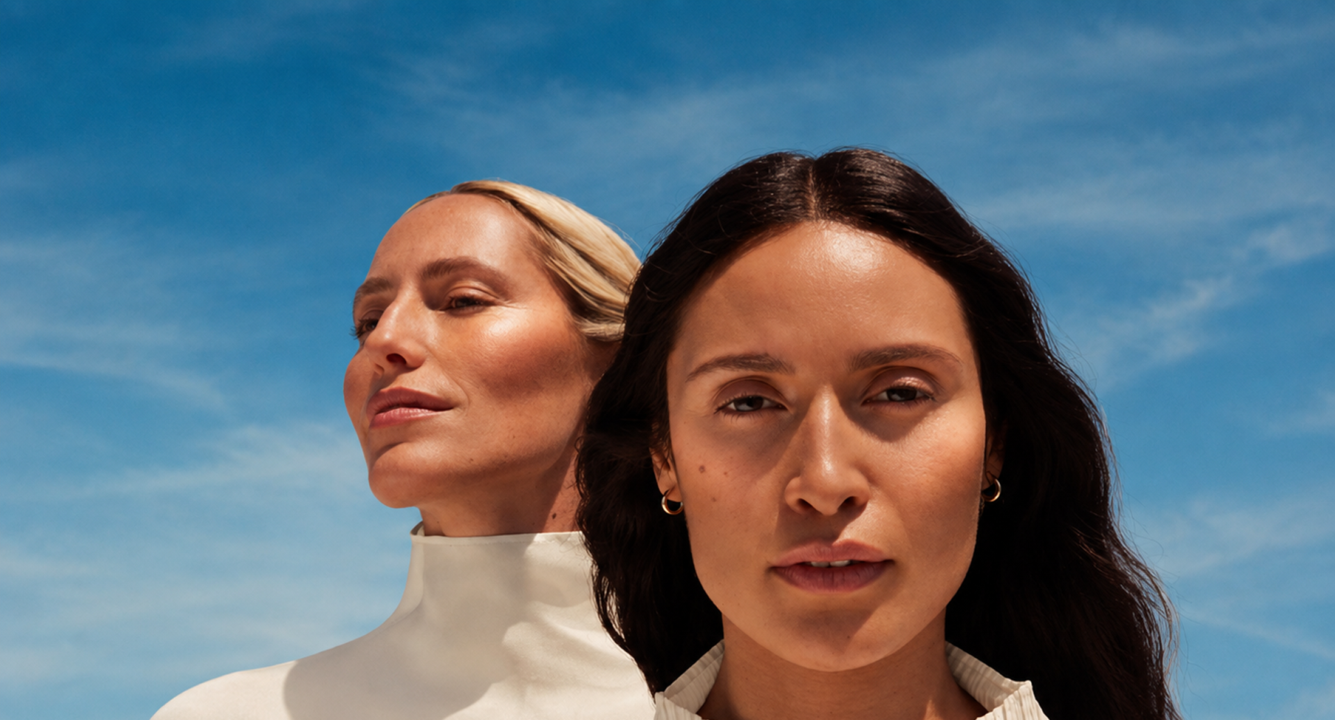 Two women against a clear blue sky